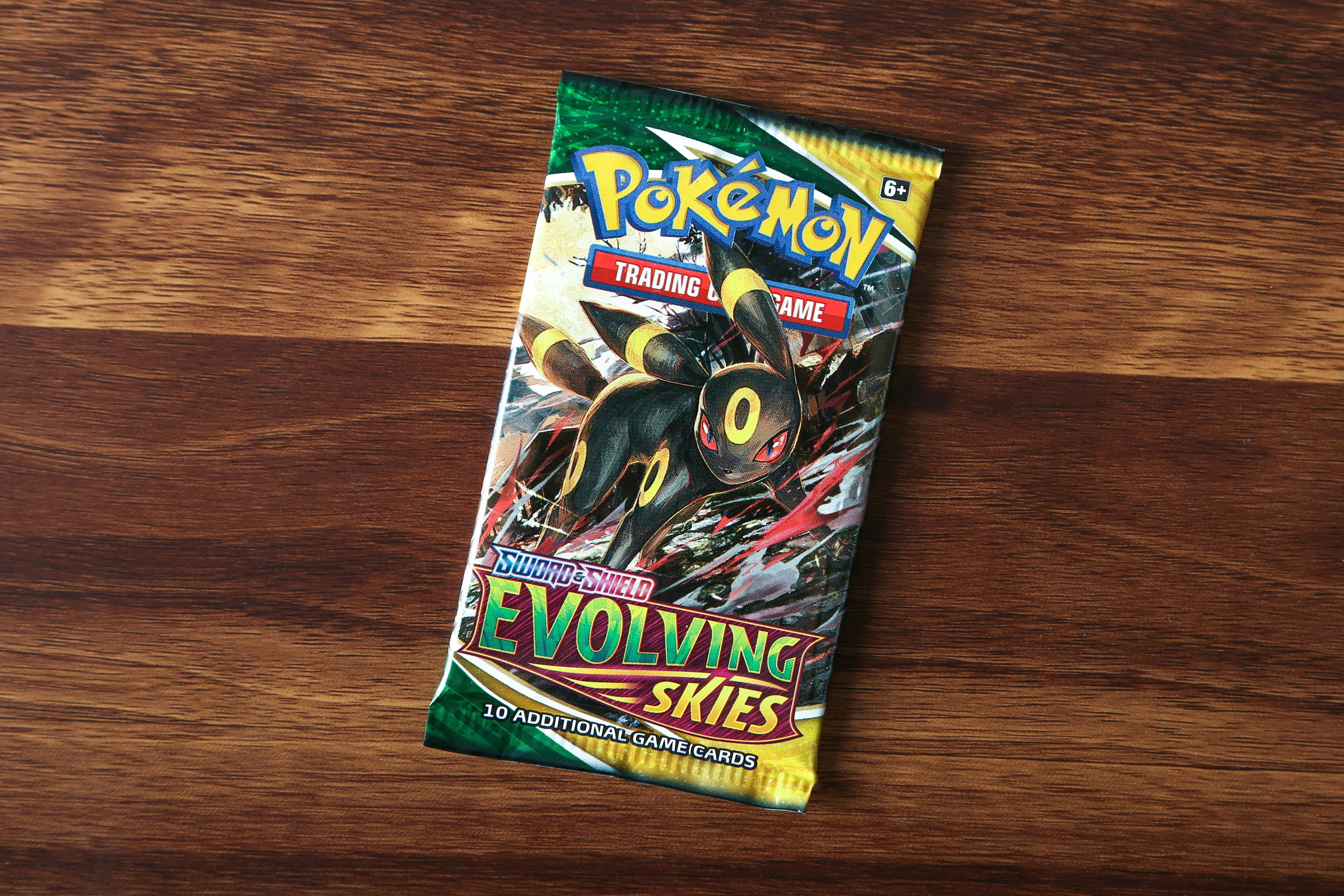 A Pokémon TCG: Evolving Skies booster pack with Umbreon art